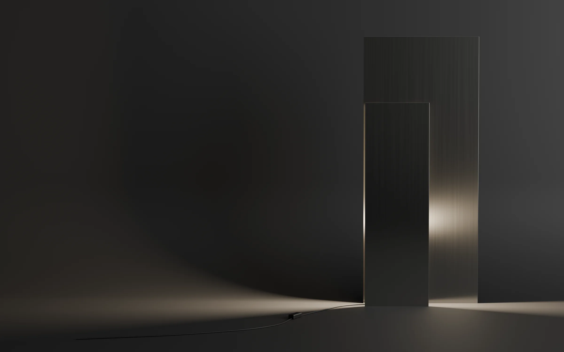 Two tall brushed-metal panels of a HOVEN floor lamp casting warm light across a dark floor